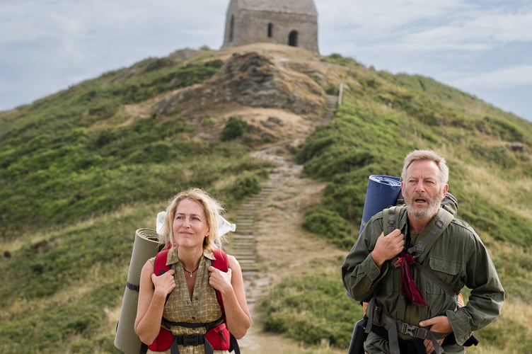 Stars Jason Isaacs and Gillian Anderson as long-distance walk couple Moth and Raynor in the film The Salt Path set in the South West.