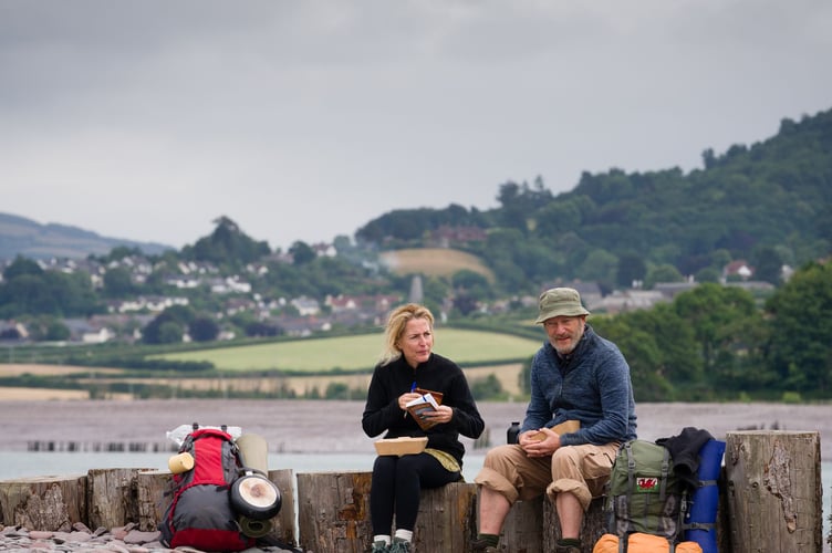 Gillian Anderson and Jason Isaacs taking a break as walkers Raynor Winn and husband Moth based on their South West Coast Path walk. Picture by Steve Tanner.