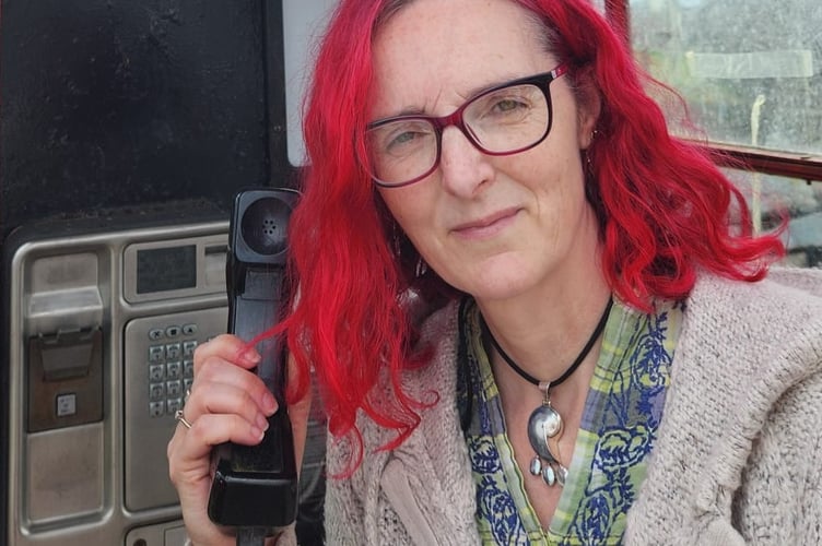 Helen Jackson and one of the remote phone boxes she is trying to save.