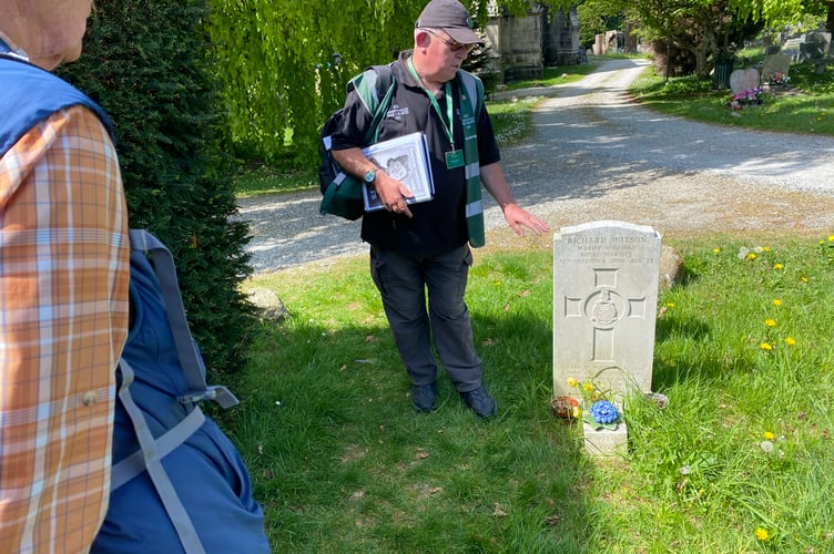 Gary Wheeler, Commonwealth War Graves Commission volunteer guide showing visitors round Tavistock Cemetery. 