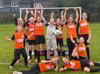 Young footballers walk for new kit