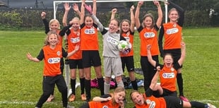 Young footballers walk for new kit
