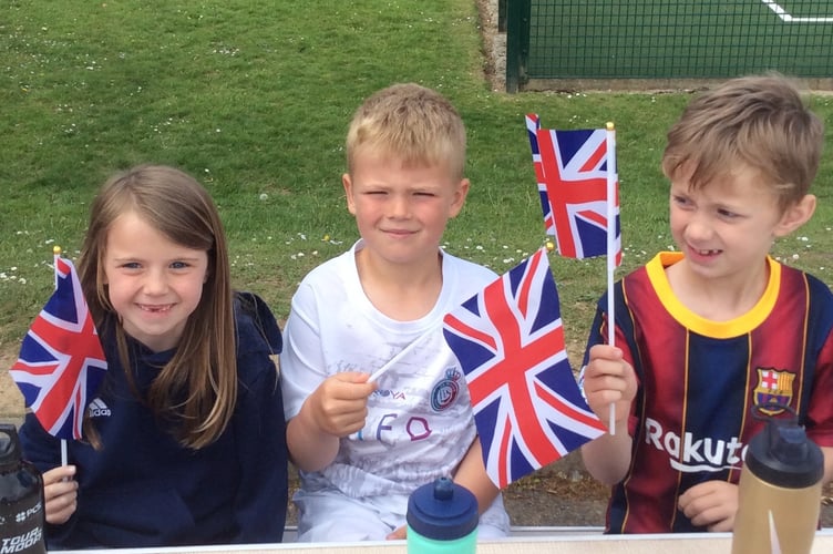 Horrabridge Primary pupils tucking into a VE Day drink.