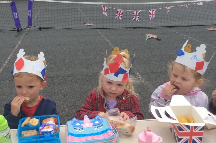 Youngsters of Horrabridge Primary School take a break to enjoy their VE Day lunch.