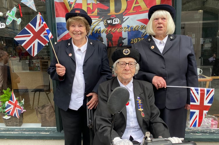 L to R Chris Wood (Salvation Army standard bearer) and Maureen Wilkinson (Royal British Legion) and Marilyn Trigger (Salvation Army) took part in a memorial ceremony at Tavistock's VE Day celebrations.