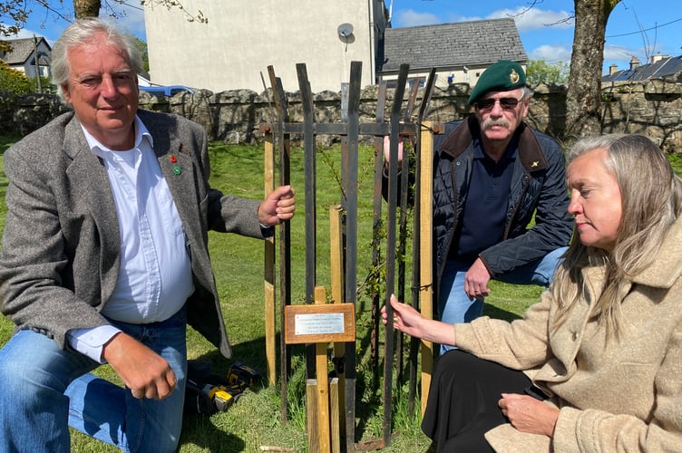 A VE Day 80 anniversary plaque fitted to a newly planted tree in Princetown's play park by Dartmoor Forest parish Council Chair Martk Williams (left) and fellow councillor Hazel Williams with veteran Royal Marine Ted Butcher.