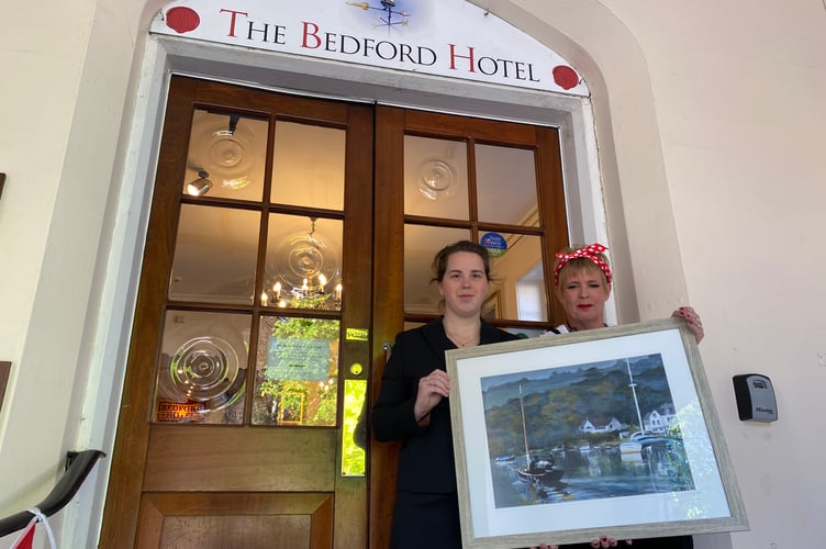 Deb Morris (left) Tavistock Area Support Services manager, and Hannah Hull, Bedford Hotel events co-ordinator, welcome new guests to a fund-raising gala dinner and auction.