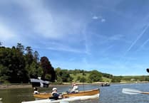 Cotehele Quay Gig Club joins flotilla to welcome explorer on rowing challenge