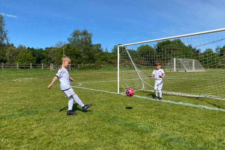 Tavistock Independent Football Academy youngsters getting in some last-minute shooting drill before their international tournament.
