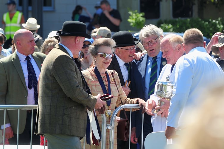 Devon County Show. Show President HRH The Princess Royal presenting prizes for show champion pigs