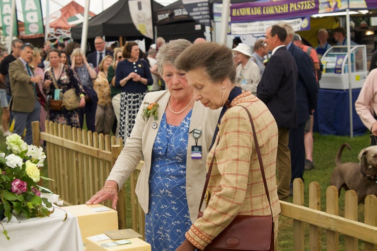 HRH The Princess Royal surveying prize-winning cheeses