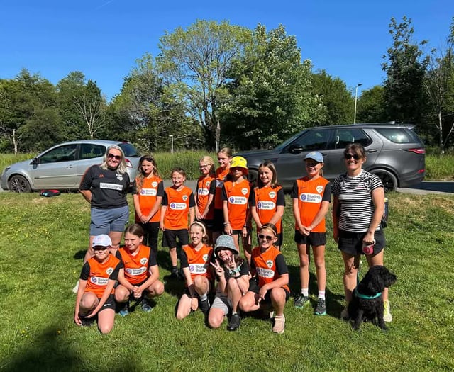 Girl footballers complete walk for new kit