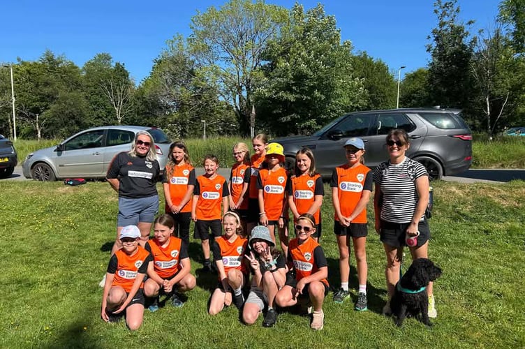 Horrabridge Rangers girls U- Xx walked from Yelverton to Tavistock to raise money for their new kit and strip