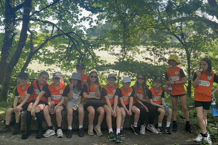Horrabridge Rangers U-10 girls on their hot six-mile walk to raise funds for new kit and strip.