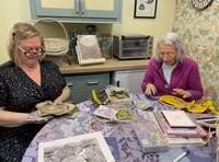 Needle crafters' display in library