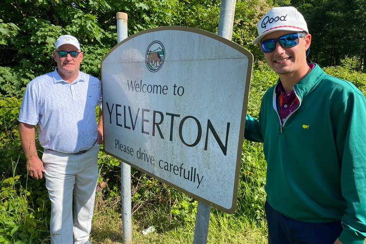 US tourists Father and son Mike and Devon Yelverton (L to R) at their namesake village of Yelverton