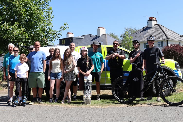 PCSO Sean Jones alongside event organisers and competition entrants.