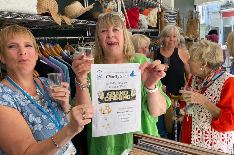Celebrations mark the re-opening of TASS charity shop on a new site after a flood.