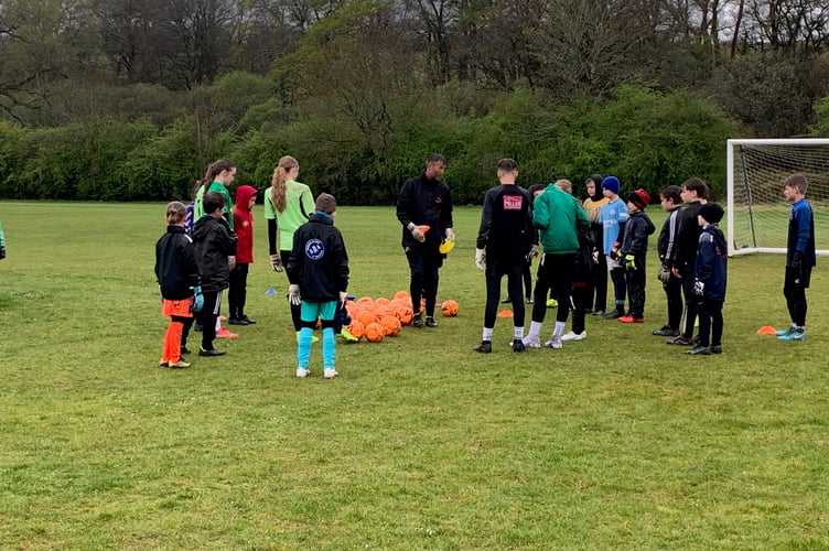 The wet weather did little to dampen the spirits of children of all ages who'd turned out to be coached at the 'Save like a Pro' session by Tavistock Football Development Centre. (Picture: Sarah Martin)