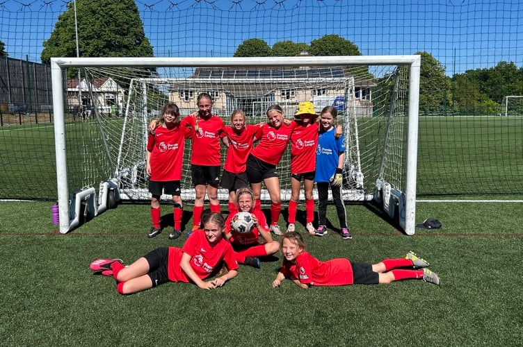 Horrabridge Primary School year 5/6 celebrate the Devon school girls football trophy.
