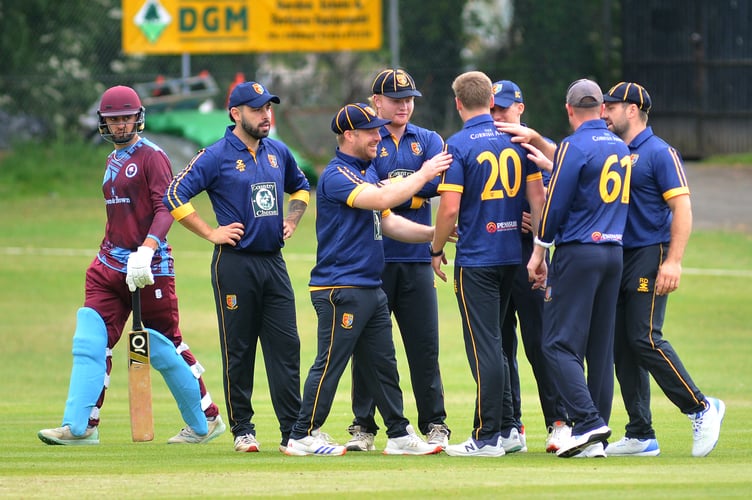 Devon Cricket League A Division. Torquay and Kingskerswell versus Tavistock. Tavi are delighted as another wicket falls - Torquay and 'Kerswell's Harry Passenger's look says it all

