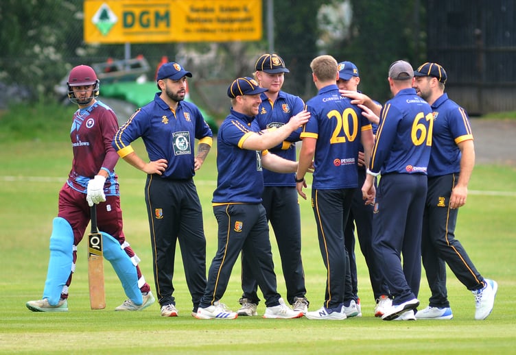 Devon Cricket League A Division. Torquay and Kingskerswell versus Tavistock. Tavi are delighted as another wicket falls - Torquay and 'Kerswell's Harry Passenger's look says it all