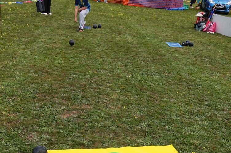 Bowling at Bere Alston Fun Day with the Tony Sidbotham the youngest member of Bere Alston Bowls Club having a go. Picture by Ann Parsons.