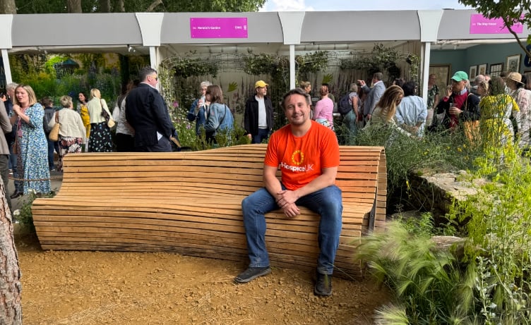 Mike Clarke, senior new business executive at Hospice UK with one of the benches.