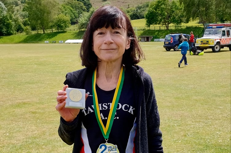 Carole Walters with her medal after completing the Two Hills Race near Chagford.