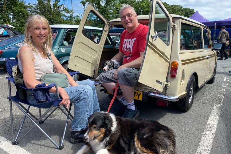 John and Penny Pritchett with dogs Obi and Alfi, from St Anns Chapel sowing off their unrestored 1982 Mini Clubman at Tavistock Steam Fair.