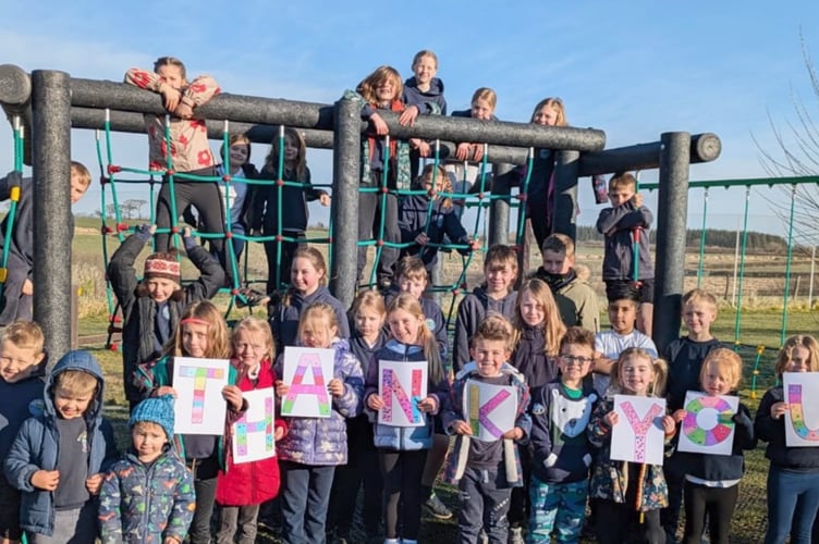 Boasley Cross Primary School pupils celebrating their new equipment.