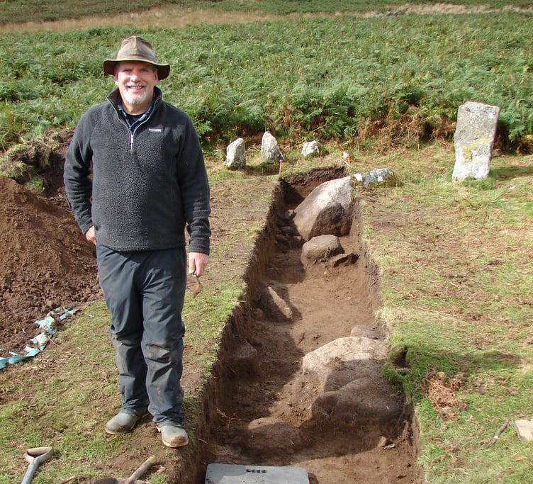 Local archaeologist Alan Endacott at his newly discovered stone circle portion and trench test, near the bottom of Irishman's Wall at Taw Marsh.