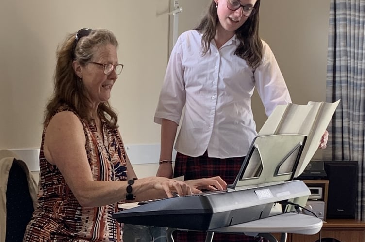 Mount Kelly College sing and play to Drake Lodge residents in Tavistock.
