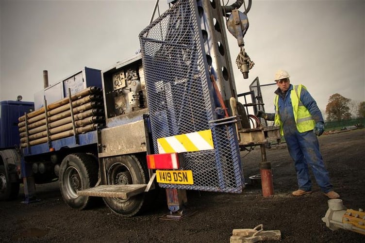 A borehole rotary drilling rig in operation at a drilling site