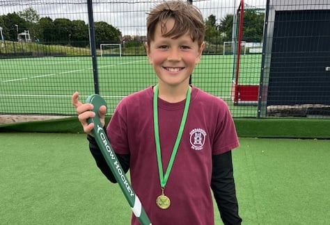 Daniel, 11, one of the star players from Horrabridge School at the primary school hockey tournament where he won the top boy play award. He is pictured with the award hockey stick he was presented with.
