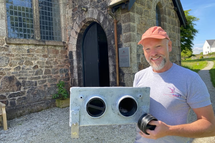 Jerry Horn, of Devon Swift Project, with a nesting box he fitted to the top of Princetown Church tower.