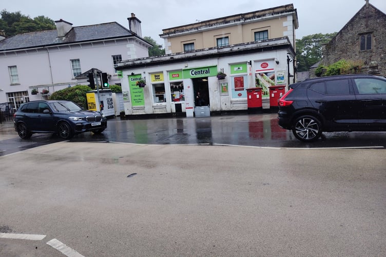 The scene outside Tavistock post office this morning, where a barrier was put up in the doorway to stop water flooding in. Picture: Guy Boswell/Tindle.