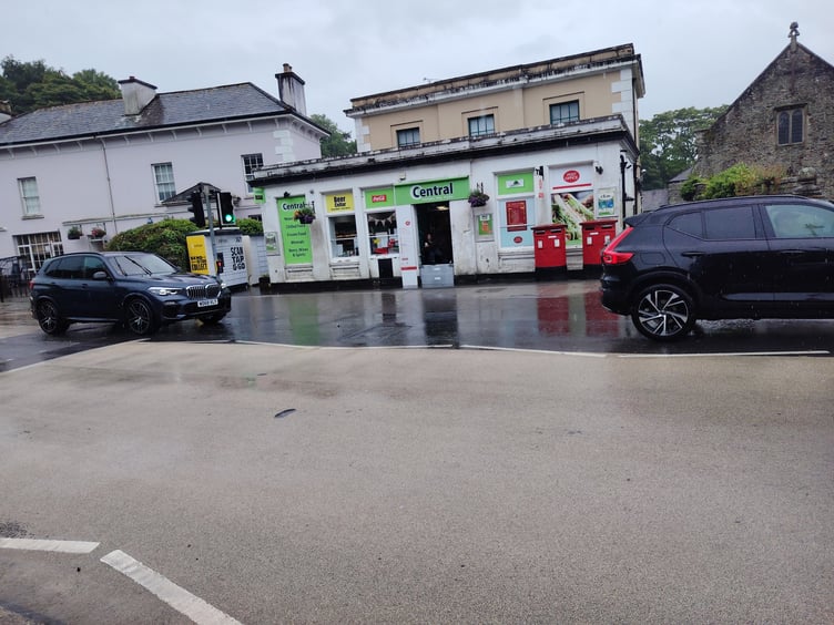 The scene outside Tavistock post office this morning, where a barrier was put up in the doorway to stop water flooding in. Picture: Guy Boswell/Tindle.
