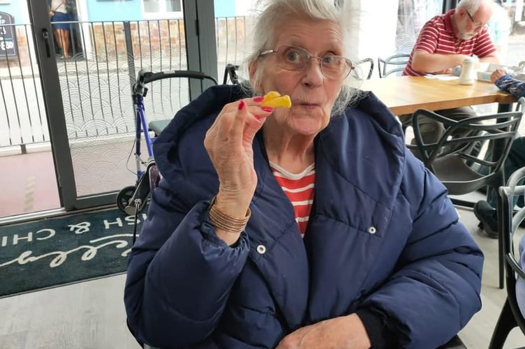 Mary Thompson in later life, enjoying fish and chips.