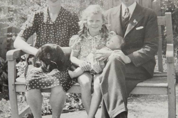 Mary as a child with parents Leslie and Vera.