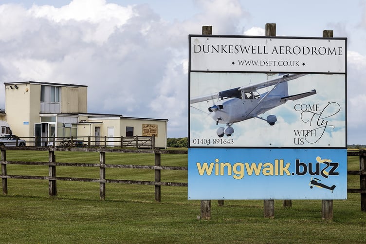 General view of Dunkeswell Airfield including Skydive Buzz, where two skydivers died after a tragic accident, involving a tandem jump on Friday June 13th. Photo released June 14 2025. In a statement issued to British Skydiving members, Chief executive Robert Gibson wrote: "Today, Friday 13 June 2025, British Skydiving has been notified of a tragic accident in which two jumpers lost their lives. Our deepest condolences go to their families, friends and the entire skydiving community. "A British Skydiving Board of Inquiry will investigate the accident. Once complete, a report - setting out the Board's conclusions and any recommendations - will be submitted to the coroner, the police, the CAA, the British Skydiving Safety & Training Committee (STC) and any other relevant authorities.