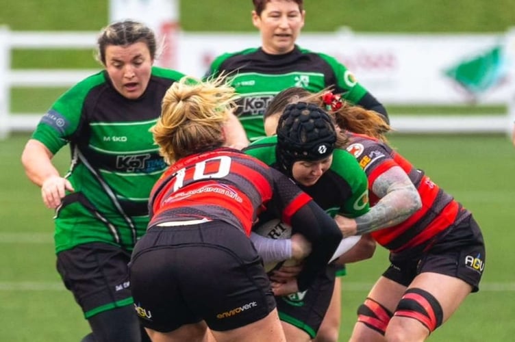Tracey Lumley powering her way through the opposition on the rugby pitch.