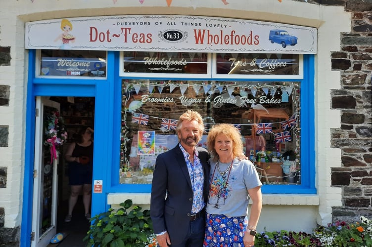 TV celebrity Noel Edmonds and shopkeeper Dotty King after he popped into her Tavistock wholefood store for a chat and brownies.