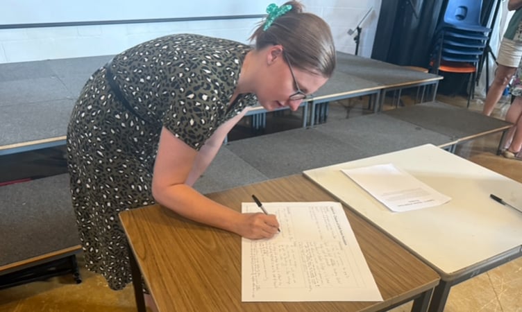 April writing her thoughts on the Okehampton College sixth form.