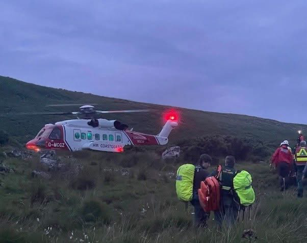 Dartmoor Search and Rescue Team, Tavistock, and HM Coastguard helicopter help an injured walkers stuck in the mud.