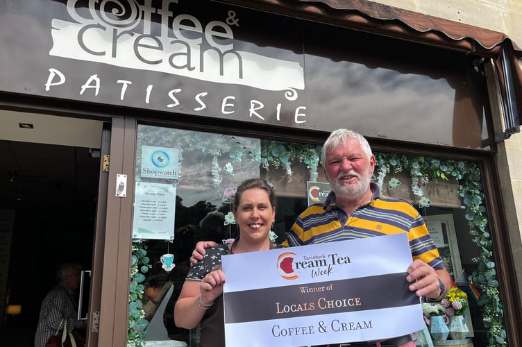 Coffee and Cream cafe owner XXX accepts her Tavistock Cream Tea Week competition 'Locals Choice' prize.
