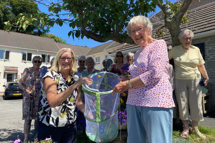 Manager Geraldine Alexander and resident Sheila Scott release their long-awaited home-bred butterflies.