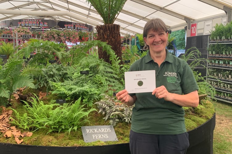 Ruth Penrose with Bowdens' silver gilt medal for their fern and tree fern display at Hampton Court Flower Show.