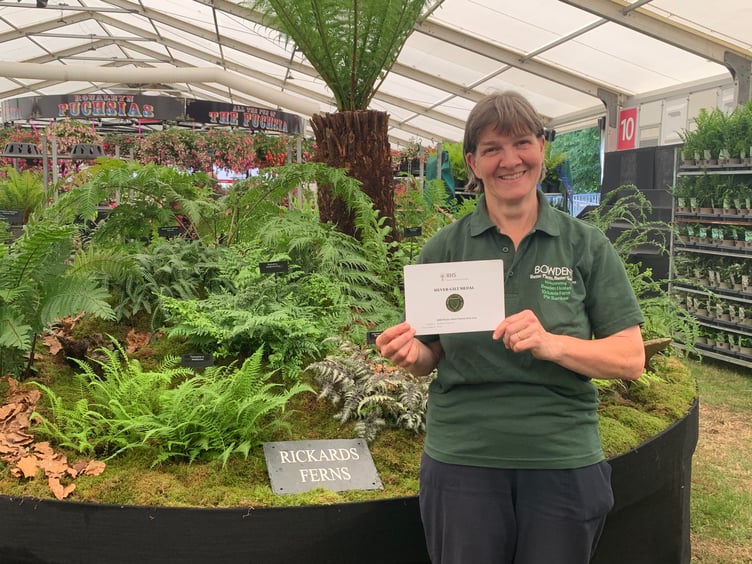 Ruth Penrose with Bowdens' silver gilt medal for their fern and tree fern display at Hampton Court Flower Show.