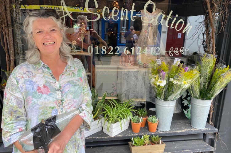 Flower expert Linda Adams, of 'A Scent-Station' florists is urging fellow Tavistock trader to keep their hanging baskets watered during the summer heat.